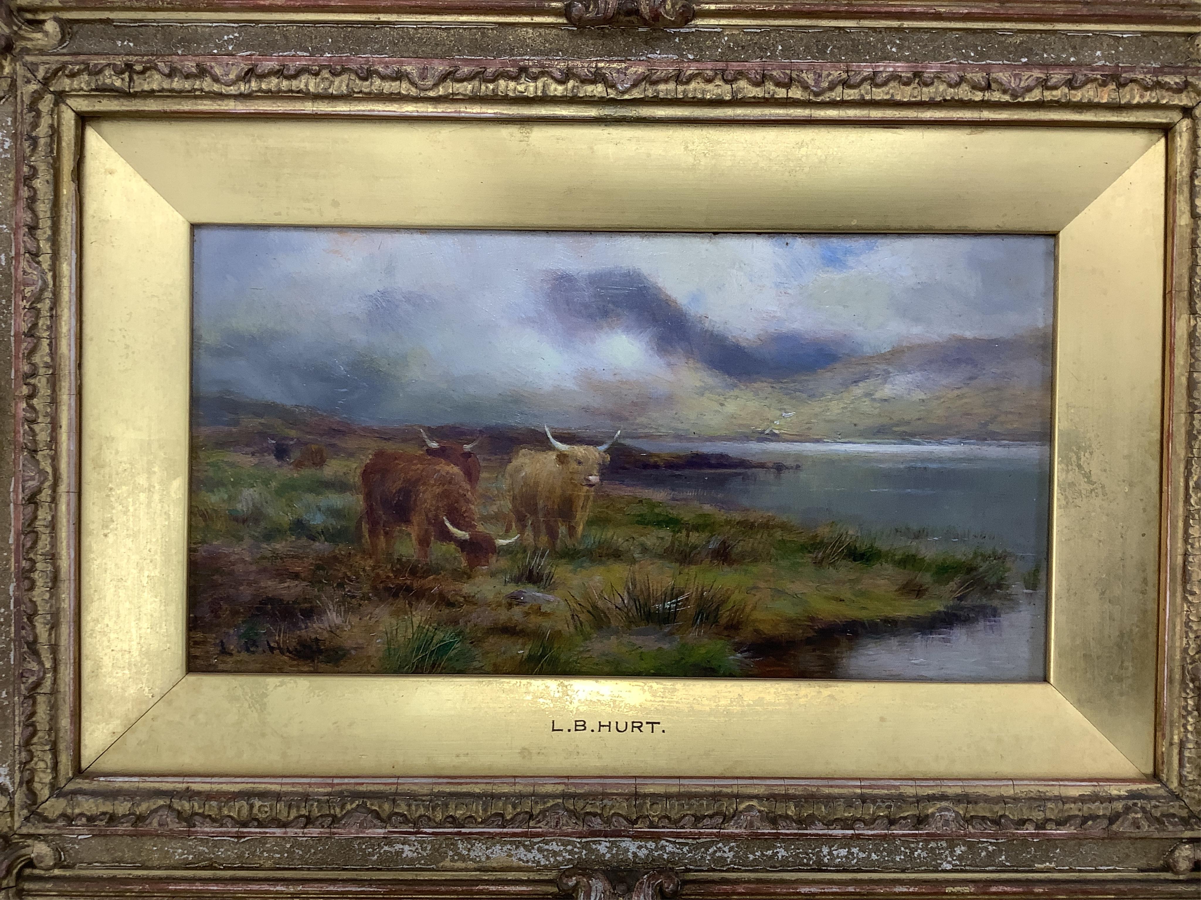Louis Bosworth Hurt (1856-1929), Highland cattle by a loch, signed, oil on board, 12 x 23cm
